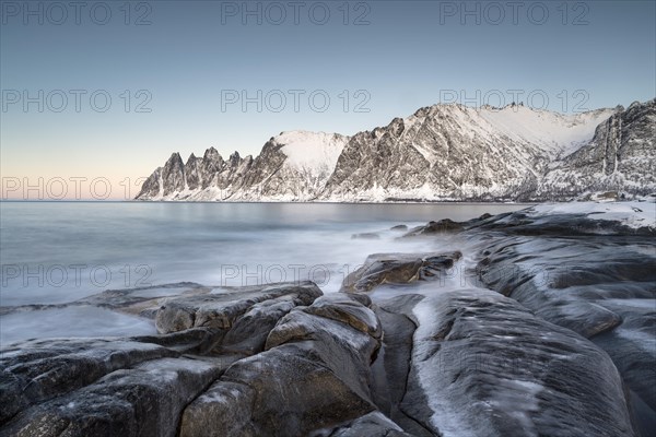 Icy coastal landscape on dusk