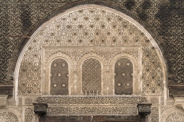 Artful carved decorations over a gate