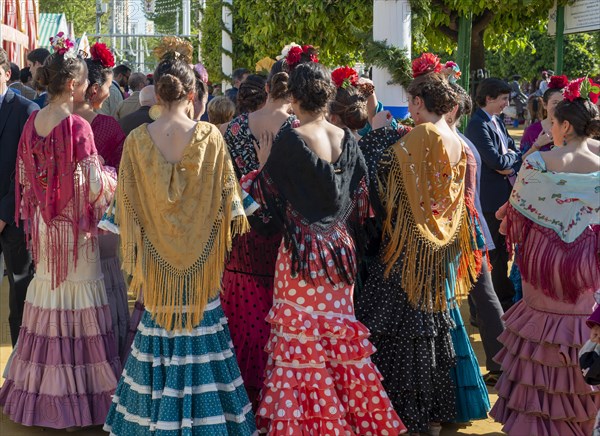 Spanish women with colorful flamenco dresses