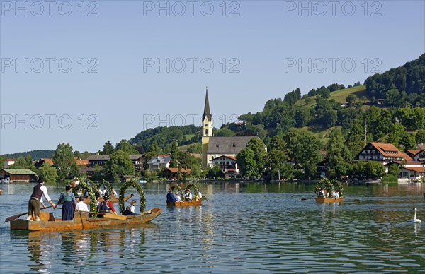 Men wearing traditional costumes in festively decorated squares