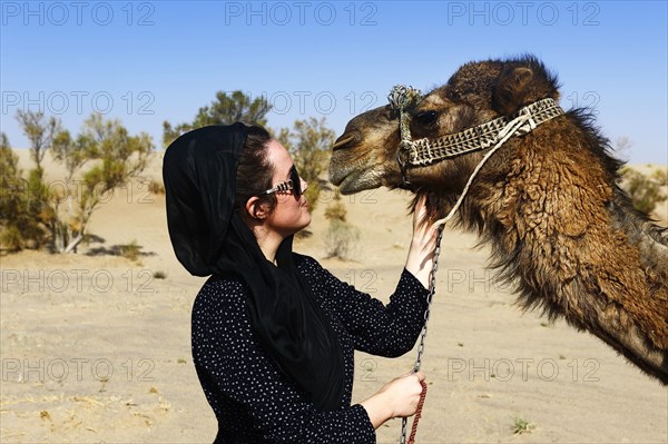 Tourist with camel on camel tour