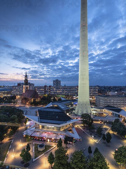 Berlin Alexanderplatz with St. Mary's Church in the evening