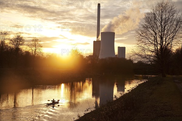 Kayaker on the Rhine-Herne Canal in the evening sun