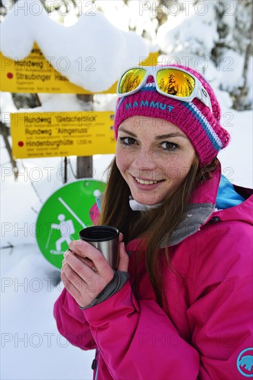 Woman in winter with tea