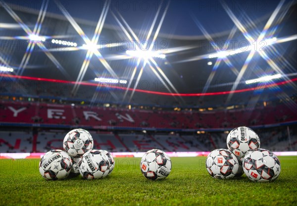 Match balls Derbystar from adidas lying on grass in the stadium