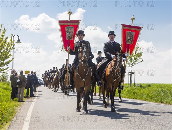 Sorbian men riding on decorated horses