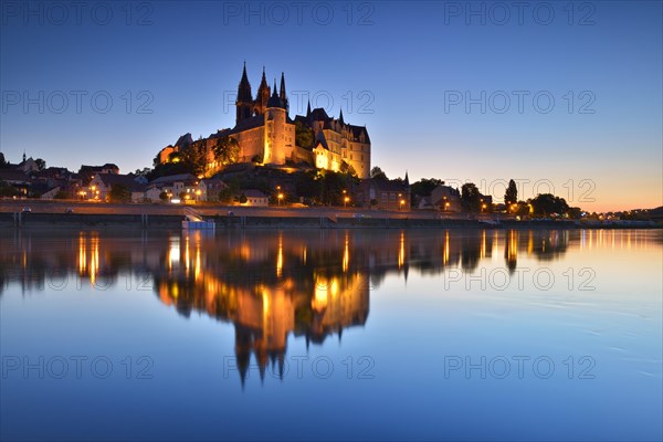 Castle hill with cathedral and castle Albrechtsburg reflected in the river Elbe