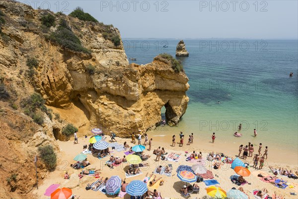Tourists and bathers at the sandy beach