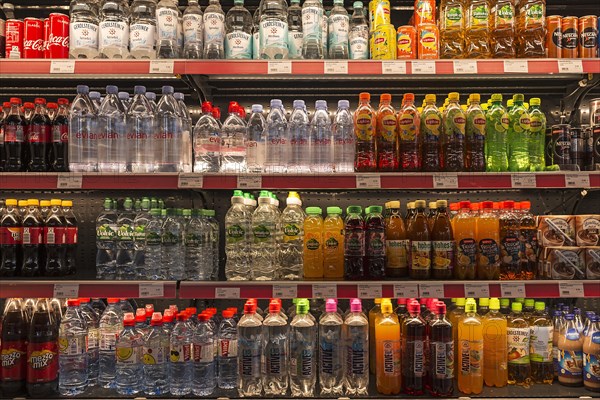 Cooling rack with beverage bottles in a motorway service area