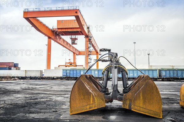 Cargo rail station with huge industrial overhead crane needed to railway transshipment