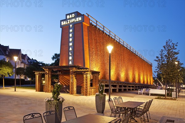 Illuminated graduation house with lettering in the blue hour