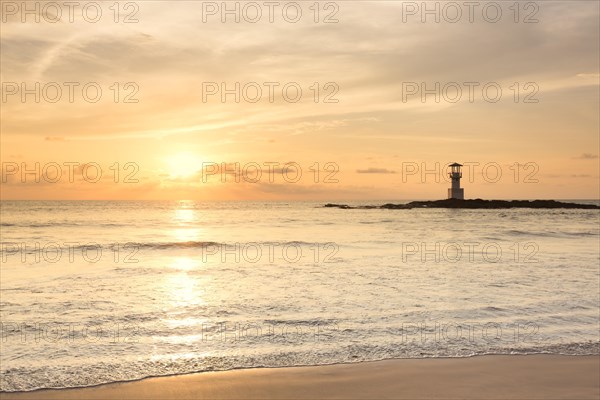 Lighthouse on Khao Lak beach at sunset