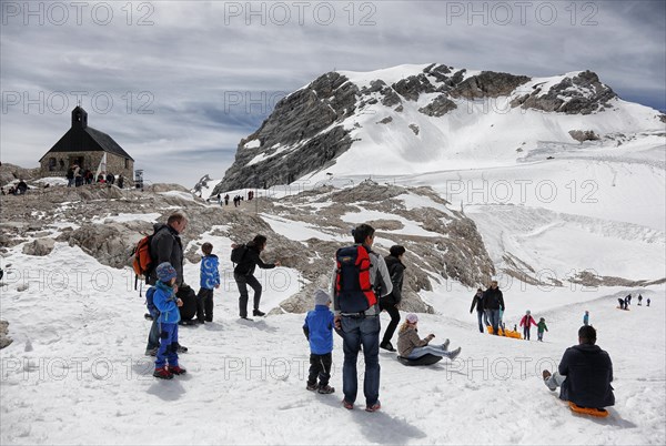 Visitors on Zugspitzplatt with chapel Maria Heimsuchung