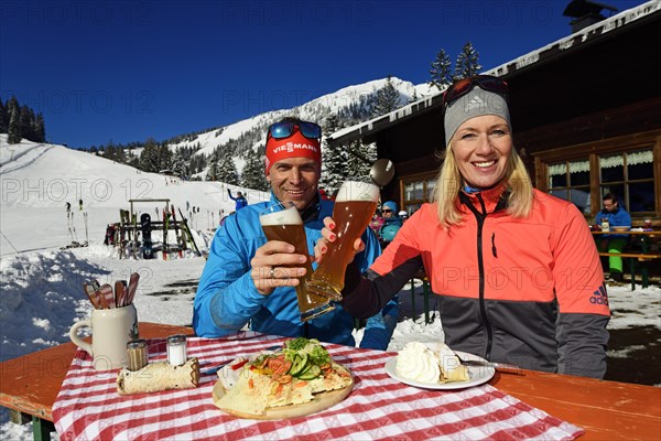 Olympic silver medal winner Tobi Angerer with his wife Romy at the snack on the Wildalm