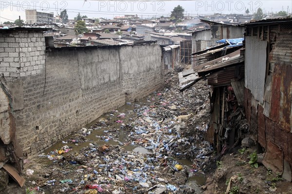 Garbage between corrugated-iron huts