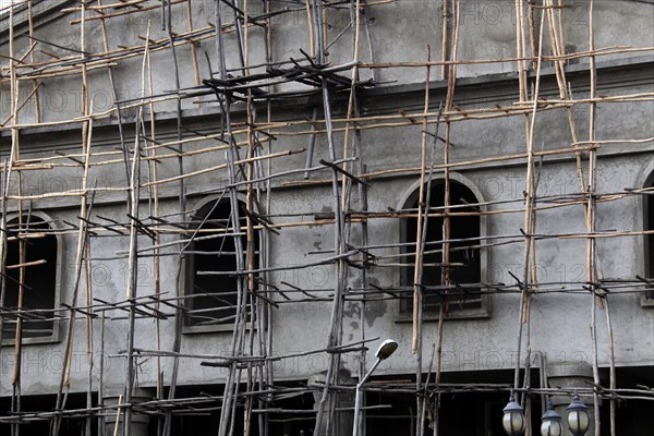 Wooden scaffolding on house wall