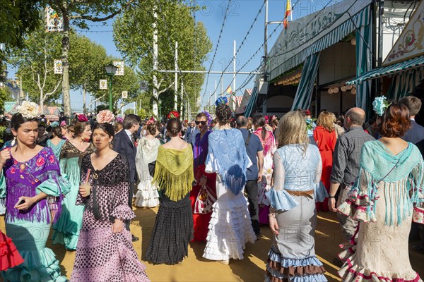 Spanish women with colorful flamenco dresses