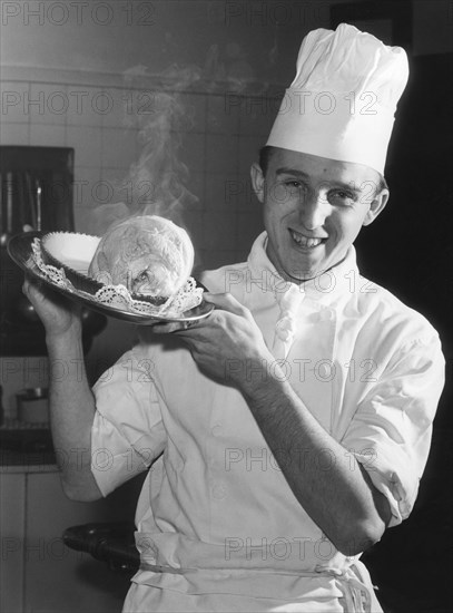 Cook serving knuckle of pork