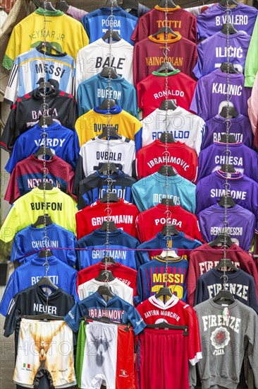 Football jerseys with names of football players for sale at sales stall