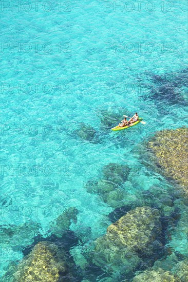 People canoeing at Cala Mitjana