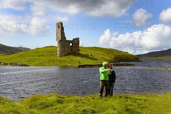 Walker at the ruins of the MacLeods of Assynt