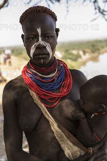 Young woman breastfeeding baby
