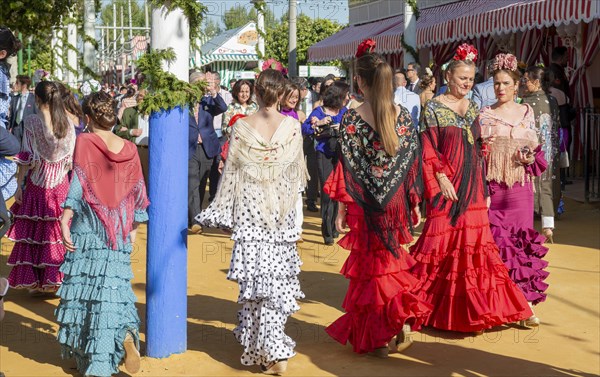 Spanish women with colorful flamenco dresses