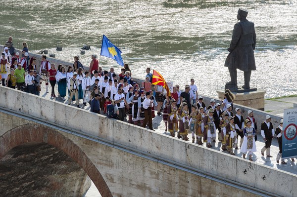 Folkloric group crossing the Stone Bridge