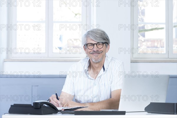 Man working at the laptop in the office