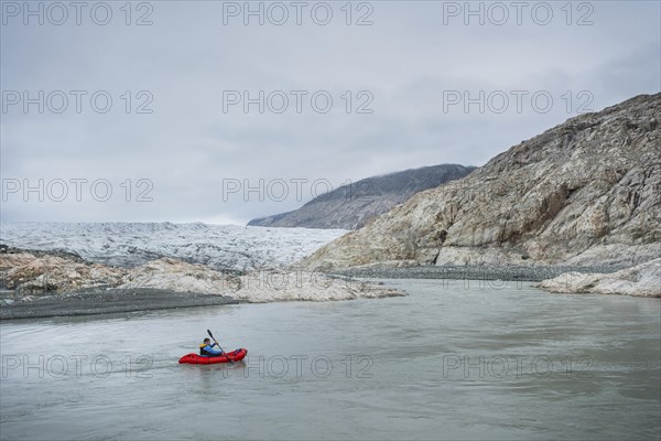 Man with Packraft on river