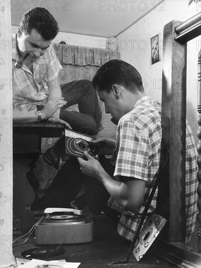 Men with pipe and old turntable