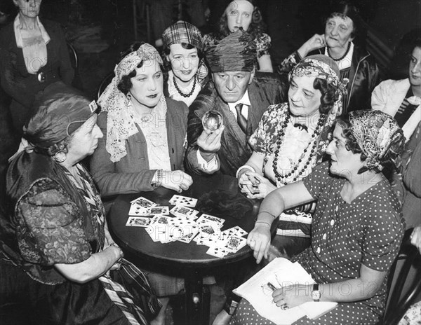 Fortune teller with tarot cards and glass ball