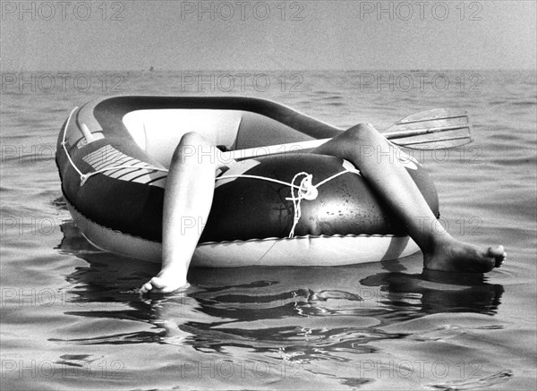 Two legs in rubber dinghy