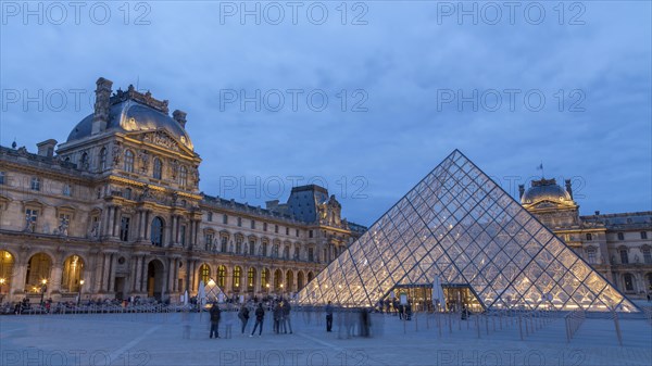 Louvre with glass pyramid at dusk