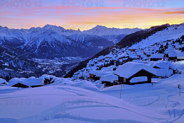 View of the snow-covered village overlooking the Rhone valley towards Dom 4545m
