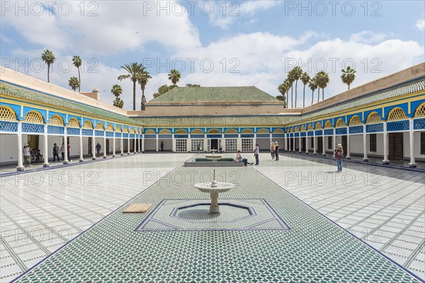 Ornate courtyard with columns and fountain