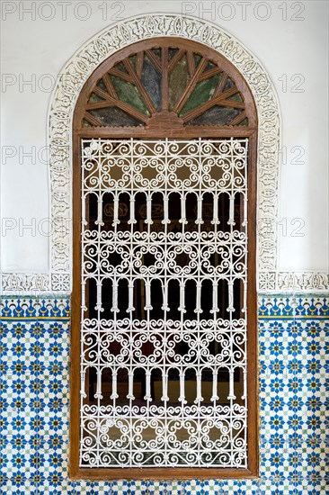 Ornate window surrounded by colorful wall tiles at the Heritage Museum