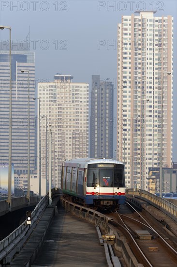 BTS Skytrain in front of skyscrapers