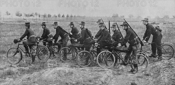 Belgian soldiers riding bikes in the countryside