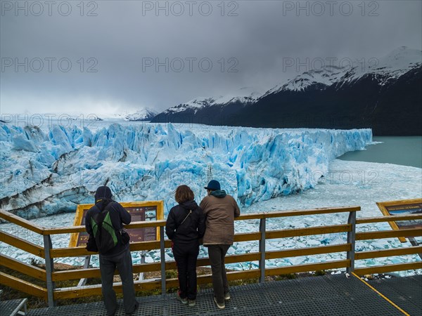 Tourists on a viewing platform at the Perito Moreno glacier