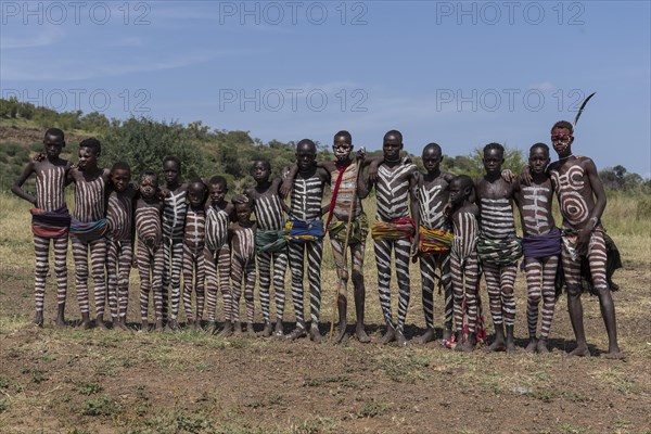 Group picture of boys and young men with typical body paintings