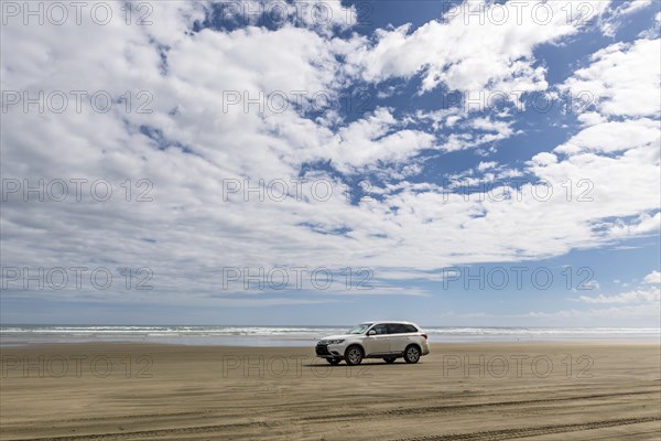 4x4 car at the wide sand beach