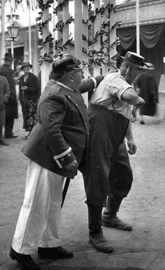 Policeman arrests a man