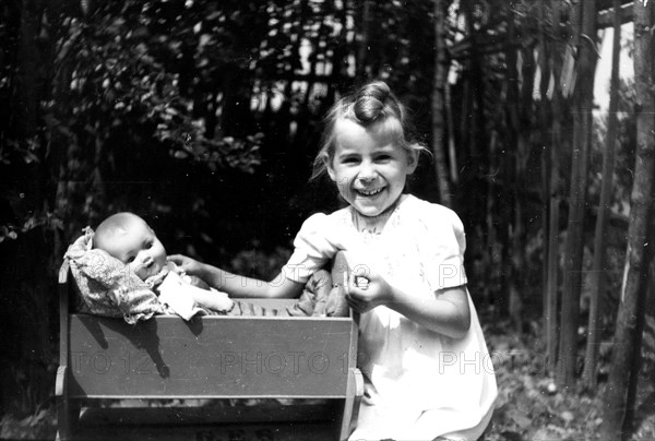 Girl playing with baby doll