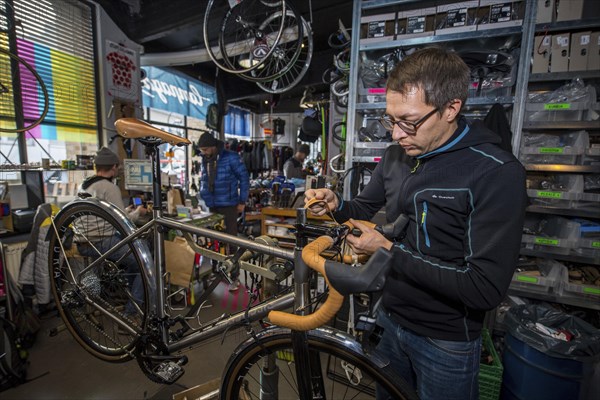 Man repairs bicycle