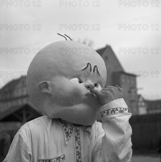 Man with huge baby mask