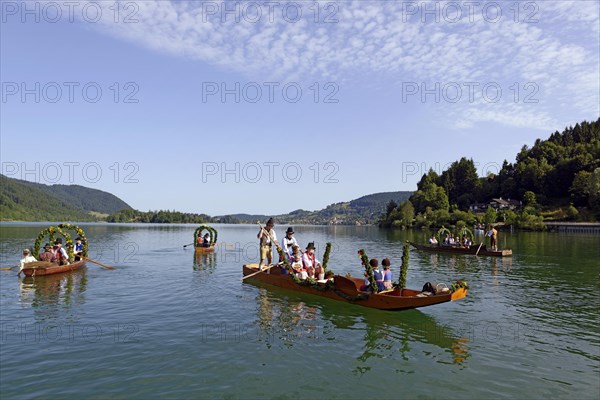 Men wearing traditional costumes in festively decorated squares