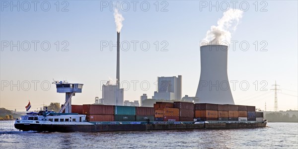 Container ship on the Rhine in front of the Duisburg-Walsum power station
