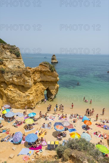Tourists and bathers at the sandy beach