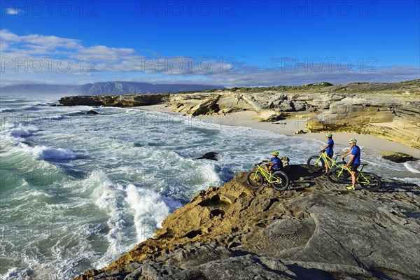 Mountain bikers with Fatbikes on cliff